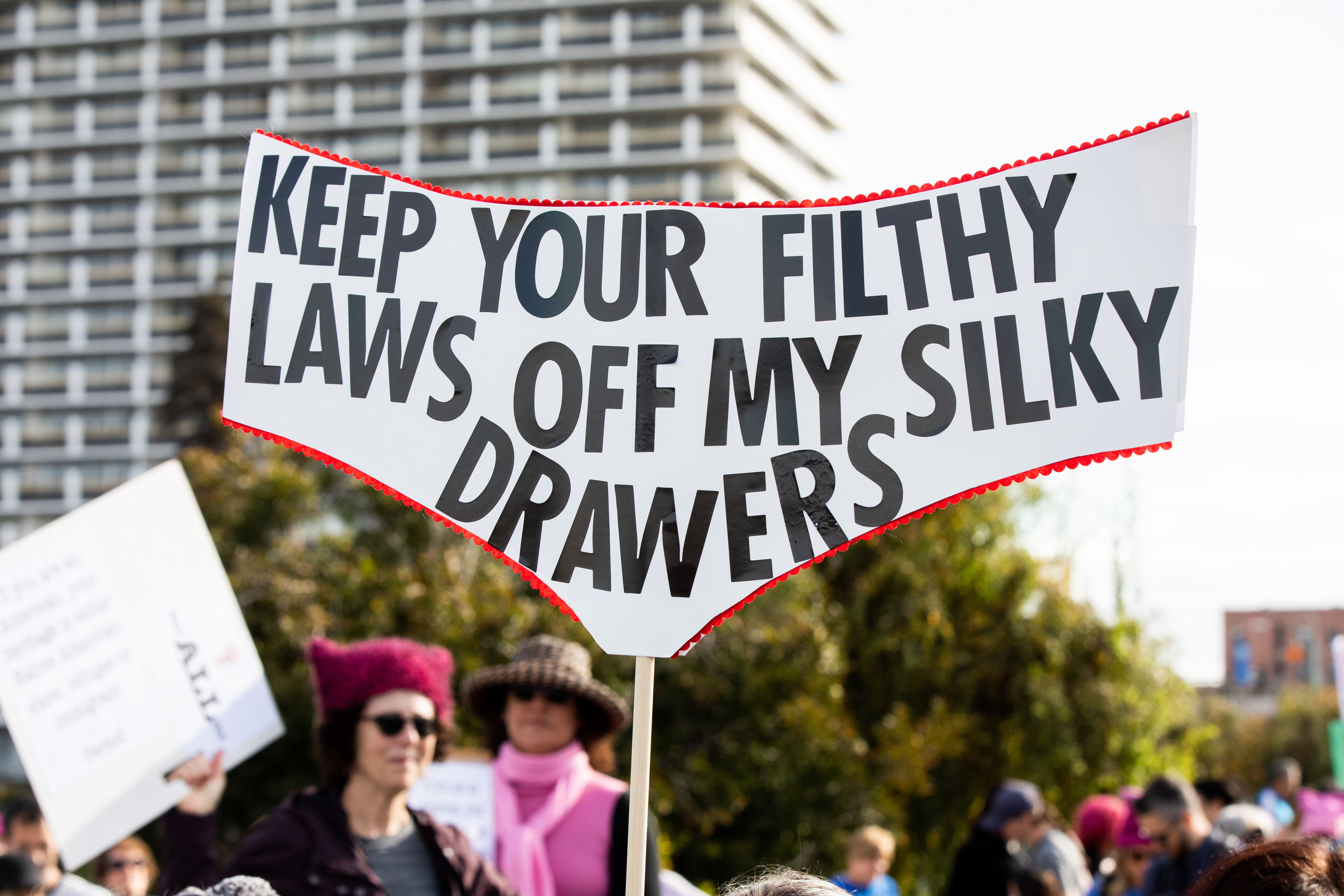 Women's March Oakland 2019, sign with caption "Keep your filthy laws off my silky drawers"