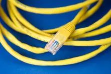 yellow LAN cable on blue background