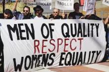 men with poster "men of quality respect womens equality"