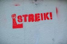 the word "Streik!" sprayed on a wall