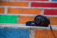 headphones on colorful stone wall