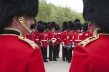 Members of the British Coldstream Guards display a very different kind of military masculinity when parading in front of Buckingham Palace in bearskin hats compared to when on patrol in Afghanistan