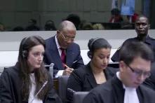 Former President of Liberia, Charles Taylor (back, centre), awaits the verdict in the case brought against him by the Special Court for Sierra Leone (SCSL) 