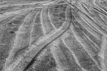 a photo of car tracks crossing each other