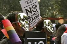 Protesters against 377 wearing silver masks in Delhi