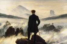 Ein Gemälde des Malers Caspar David Friedrich: Ein Mann blickt über ein Meer an Wolken.