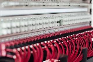 Fibre optic cable rack with red cables