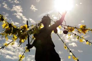 Justitia Justitia in the sunlight with grape leaves