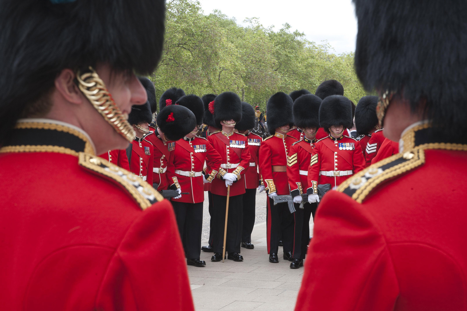 Members of the British Coldstream Guards display a very different kind of military masculinity when parading in front of Buckingham Palace in bearskin hats compared to when on patrol in Afghanistan Members of the British Coldstream Guards display a very different kind of military masculinity when parading in front of Buckingham Palace in bearskin hats compared to when on patrol in Afghanistan