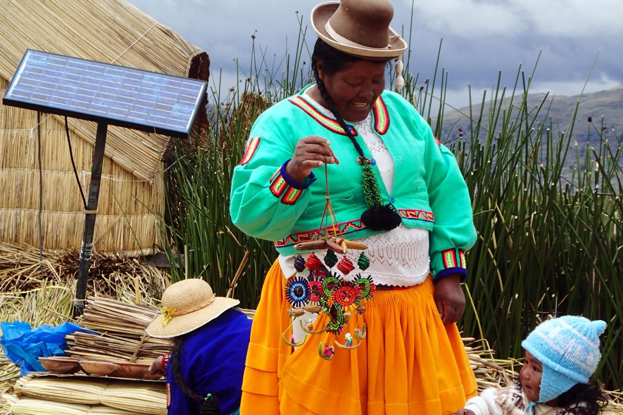 Locals, Uros Floating Islands, Lake Titicaca, Peru, South America Locals, Uros Floating Islands, Lake Titicaca, Peru, South America